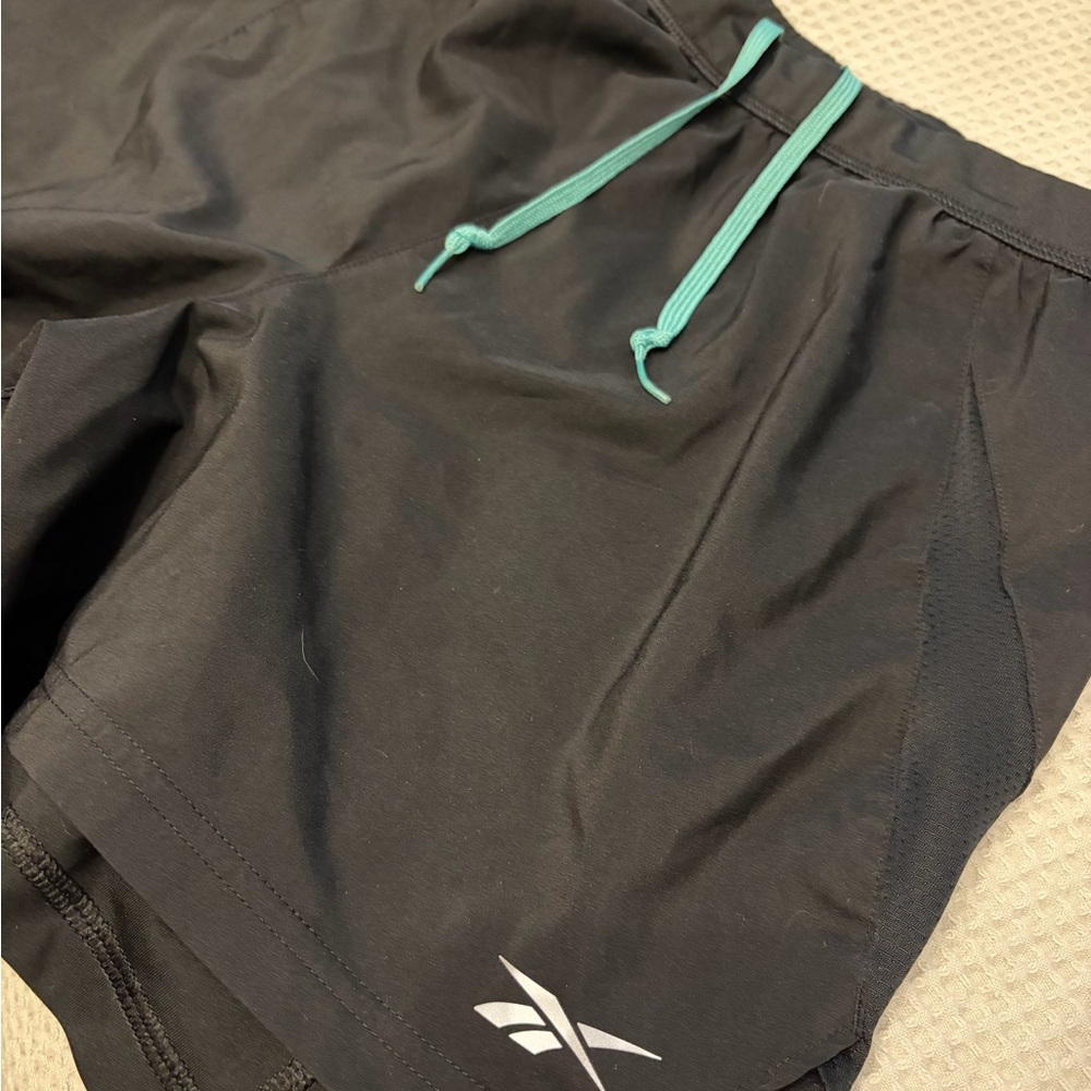 Reebok Men's Black Athletic Shorts with Teal Accents